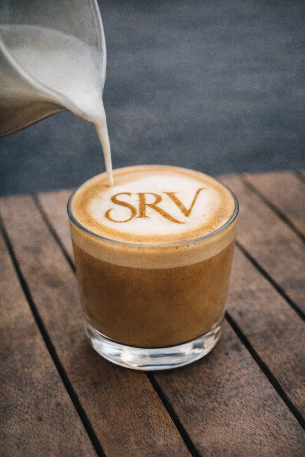 SRV branded flat white being poured