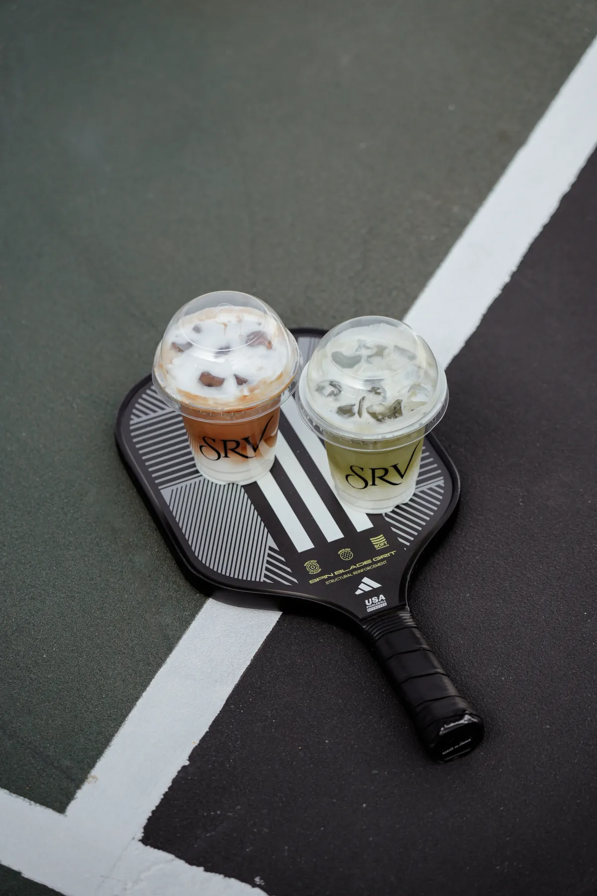 SRV branded drinks on the padel court